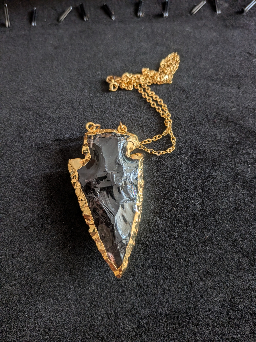 Gold-Trim Black Arrowhead Pendant Necklace